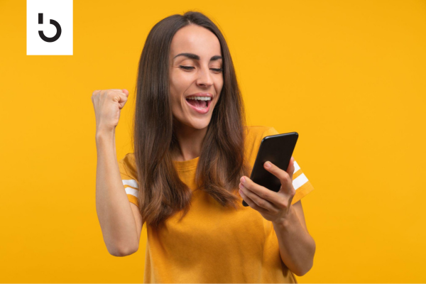successful investor looking at her phone in excitement