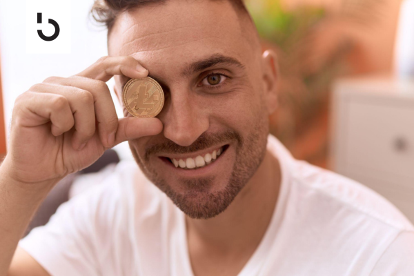 litecoin investor holding a gold litecoin coin